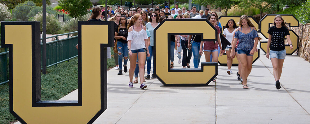 photograph of students walking down the UCCS spine